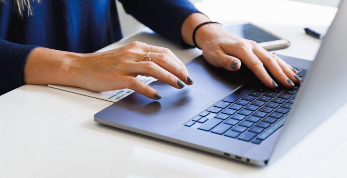 Woman typing on laptop